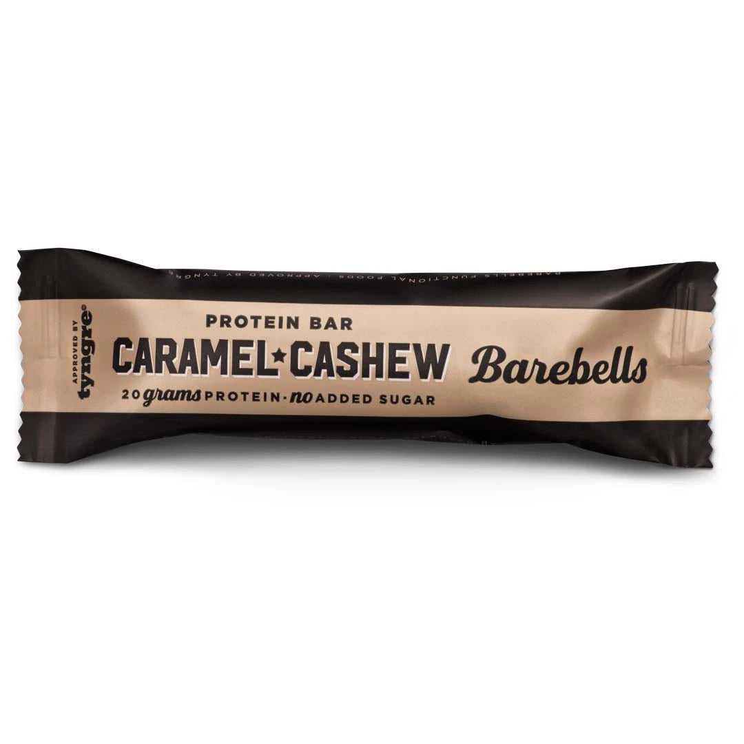 Barebells Soft protein bar 55 g tummanruskeassa ja beigessä pakkauksessa, makuna Caramel Cashew.