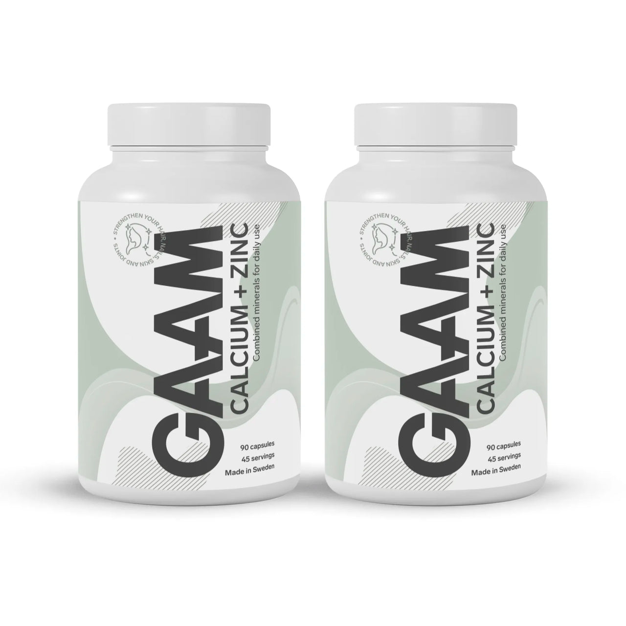 2 x GAAM Calcium + Zinc 90 caps -lisä valkoisissa purkeissa, joissa harmaanvihreitä yksityiskohtia ja musta teksti.