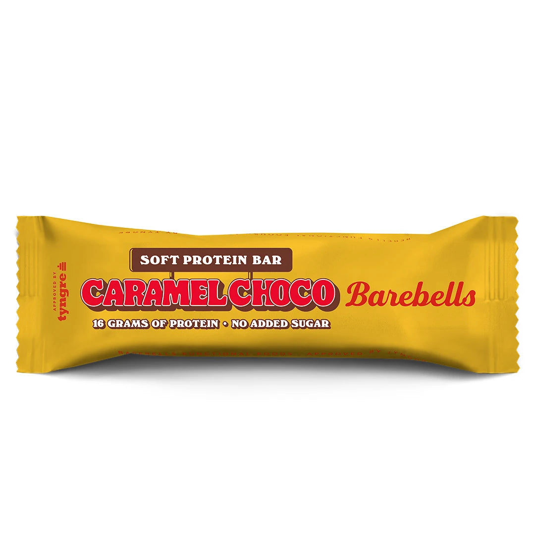 Barebells Soft protein bar 55 g keltaisessa pakkauksessa, jossa on punainen teksti, makuna Caramel Choco., kuva 3/19