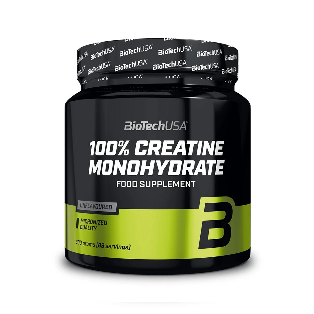 BioTechUSA 100% Creatine Monohydrate 300 g on maustamaton kreatiinijauhe mustassa purkissa, jossa on vihreitä yksityiskohtia.