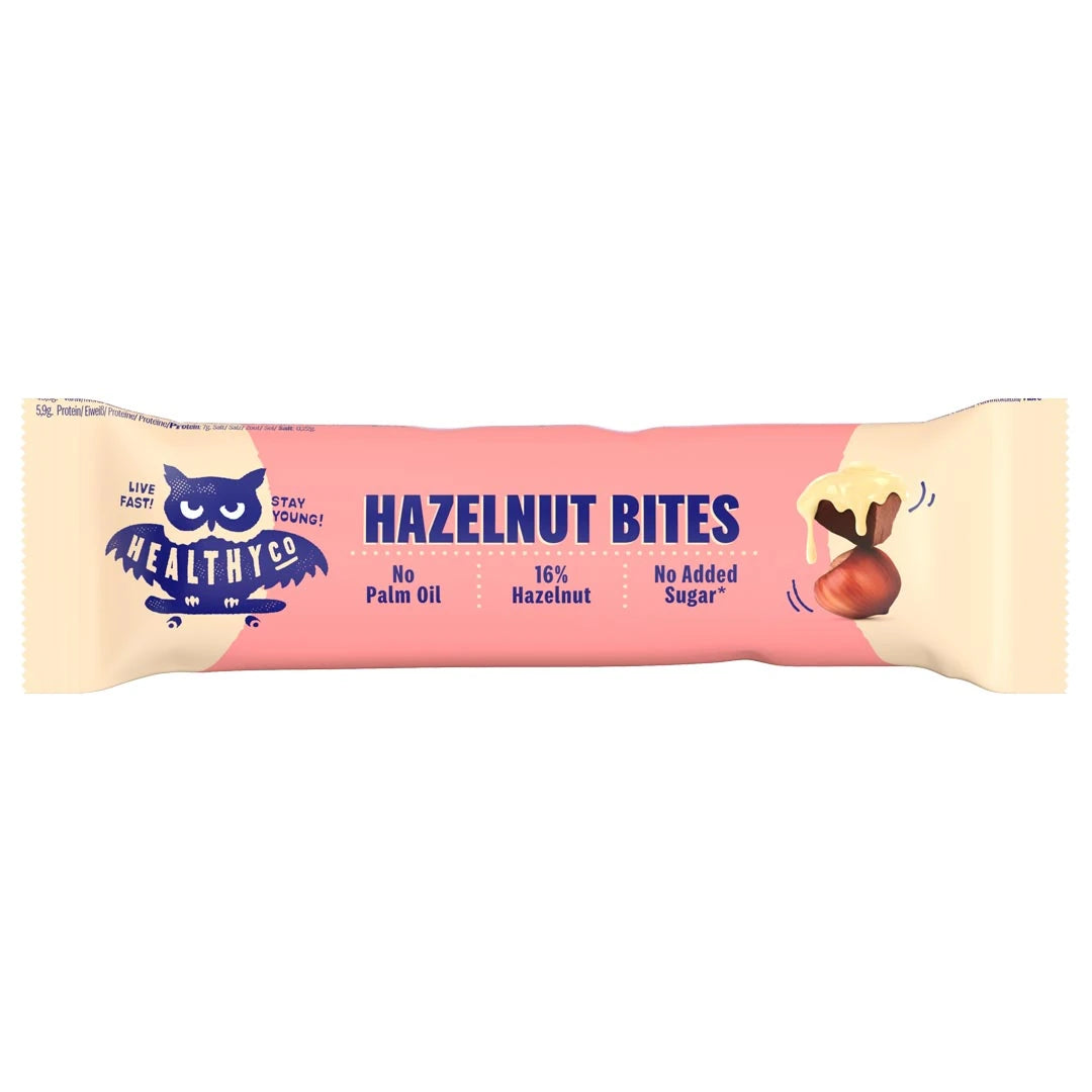HealthyCo Hazelnut Bites 21 g -suklaapala vaaleanpunaisessa ja beigessä kääreessä tummansinisellä tekstillä.
