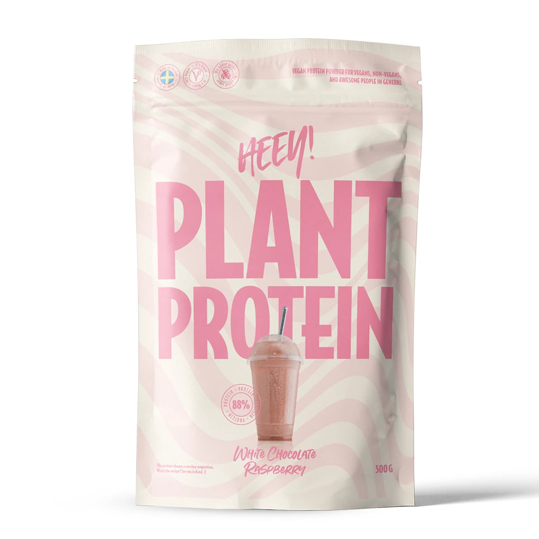 Heey! Veganskt Protein 500 g -proteiinijauhe vaaleassa pussissa vaaleanpunaisella tekstillä, makuna White Chocolate Raspberry.
