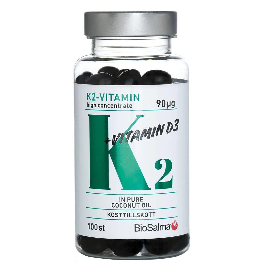 BioSalma K2-vitamin High Concentrate 90 µg 100 caps läpinäkyvässä hopeakantisessa purkissa, jossa on tummia kapseleita.