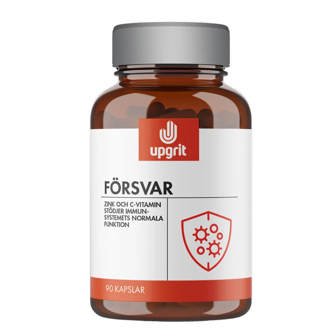 Upgrit Försvar 90 caps -ravintolisä tummassa lasipurkissa, jossa on valkoinen etiketti ja hopeinen kansi.