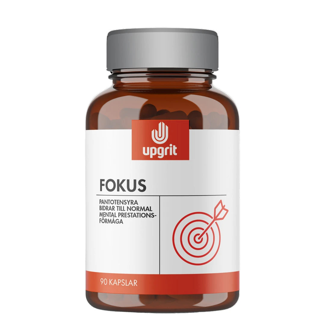 Upgrit Fokus 90 caps -ravintolisä ruskeassa purkissa, jossa on harmaa kansi, valkoinen etiketti ja punainen maalitaulu.