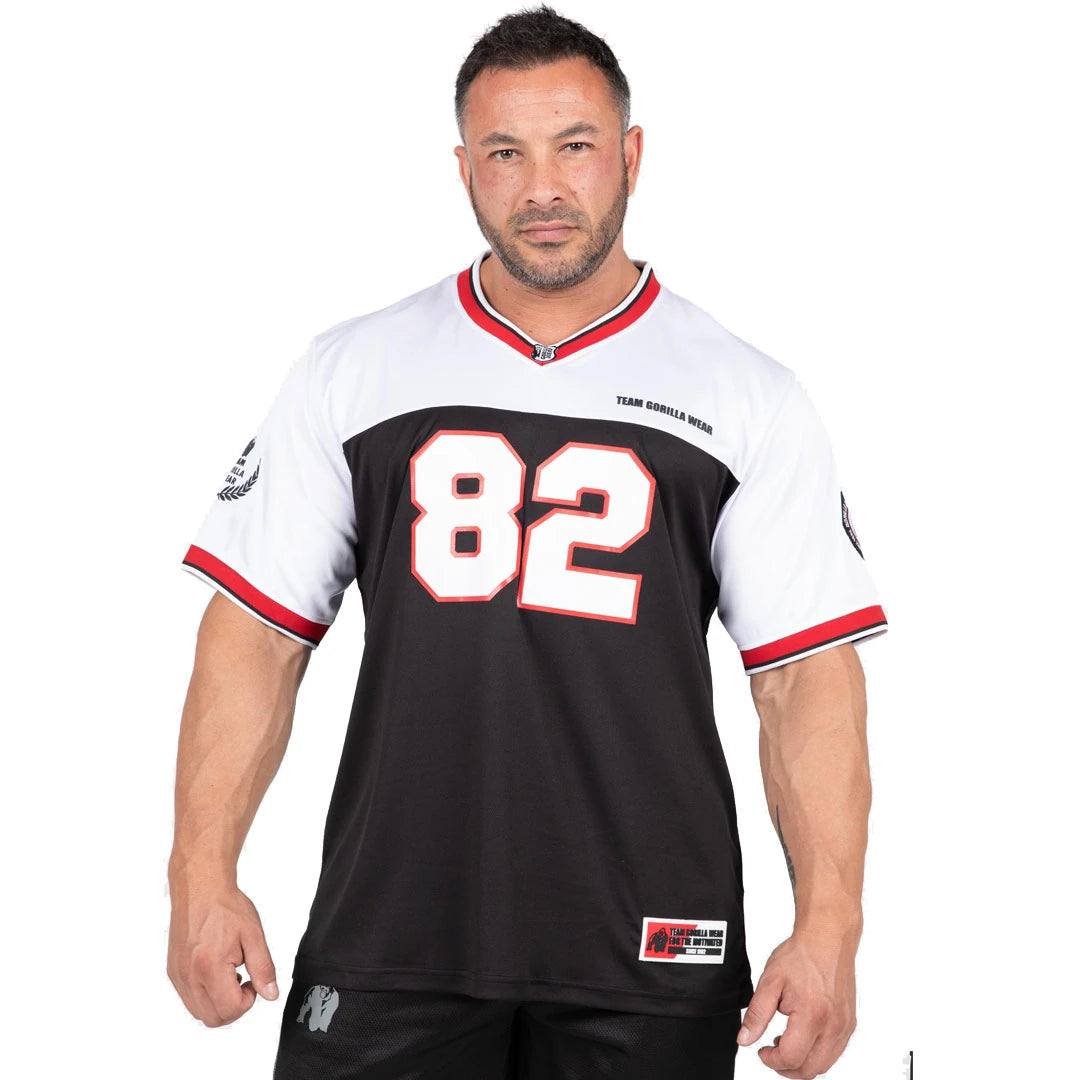 Gorilla Wear Trenton Football Jersey Black/White on mustavalkoinen mesh-treenipaita, jossa on v-aukko ja 82-painatus.