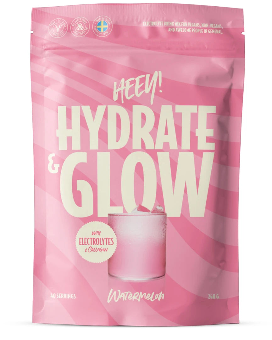 Heey! Elektrolyter + Coll-egan® Passionsfrukt 240 g -jauhe vaaleanpunaisessa pussissa valkoisilla yksityiskohdilla.
