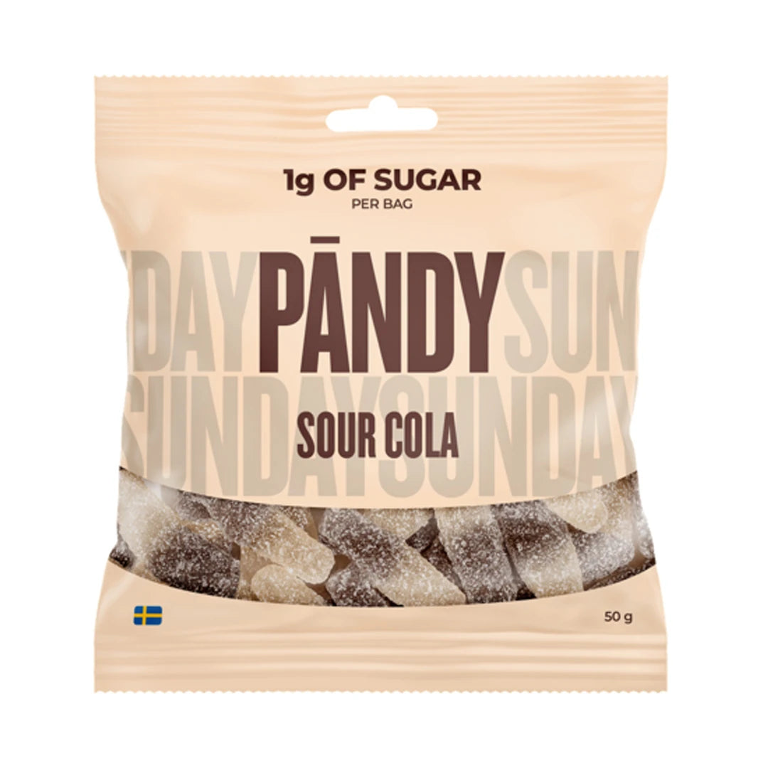 Pändy Candy Sour Cola 50 g kirpeitä colanappeja vaaleassa pussissa, jossa on läpinäkyvä ikkuna ja ruskea teksti.