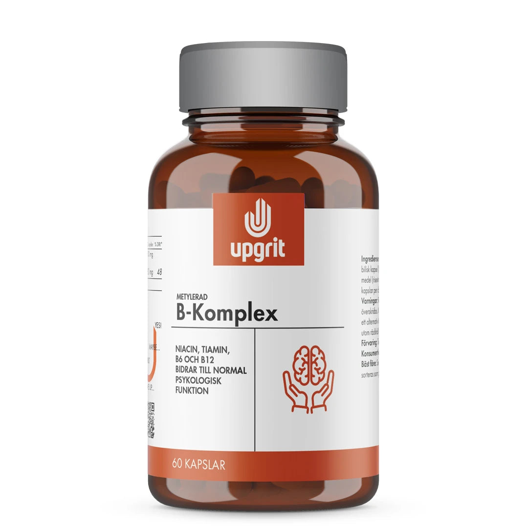 Upgrit B-Komplex 60 kapselia tummanruskeassa purkissa, jossa on hopeinen kansi ja valko-oranssi etiketti.