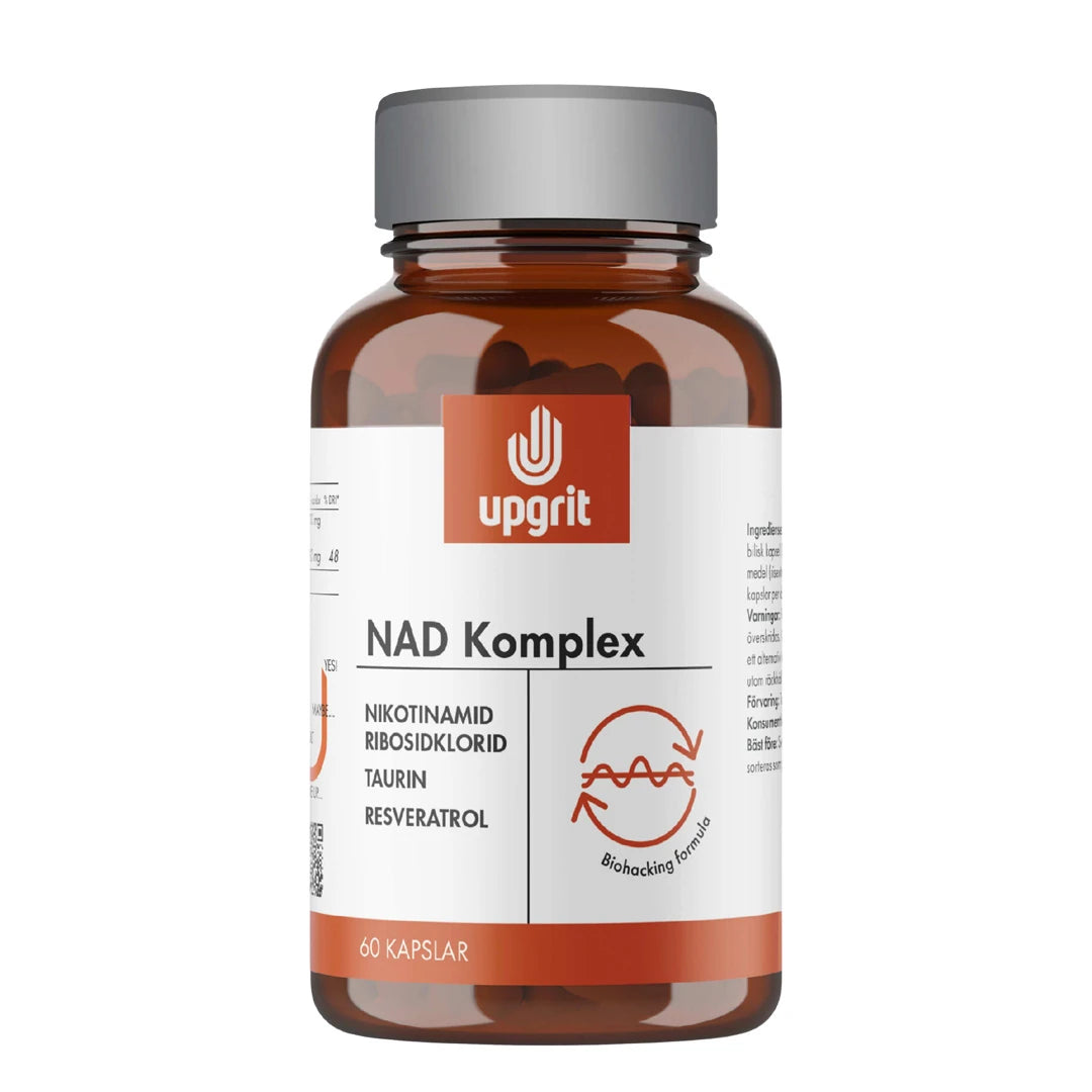Upgrit NAD-Komplex 60 kapselia ruskeassa lasipurkissa, jossa on valkoinen etiketti ja oransseja yksityiskohtia.