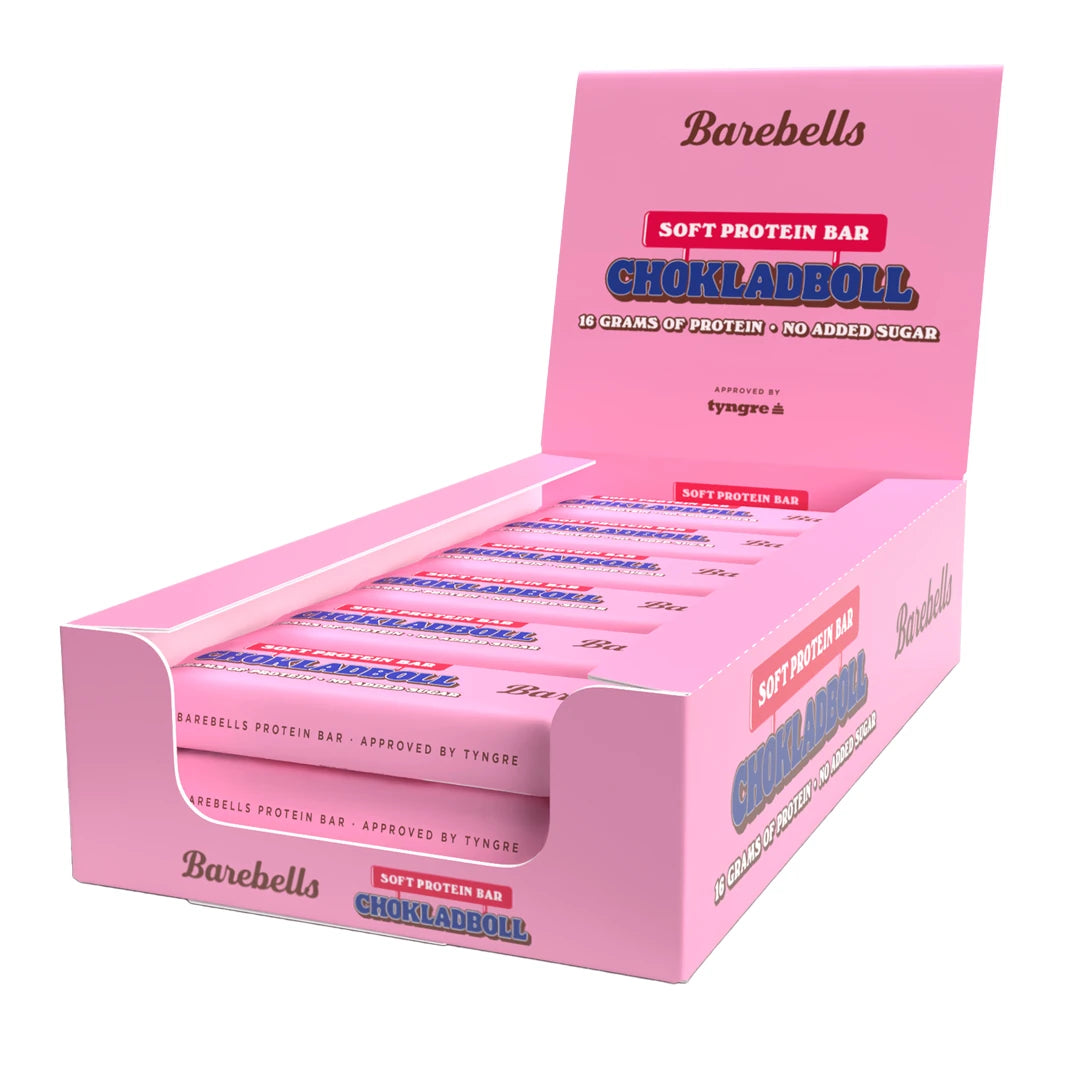 12 x Barebells Soft Bar 55 g Chokladboll vaaleanpunaisessa esittelylaatikossa täynnä proteiinipatukoita.