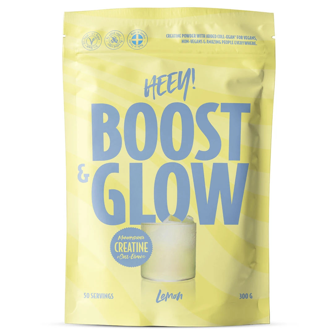 Heey! Boost & Glow Creatine + Coll-egan® 300 g -kreatiinijauhe keltaisessa pussissa sinisellä tekstillä, makuna Lemon.