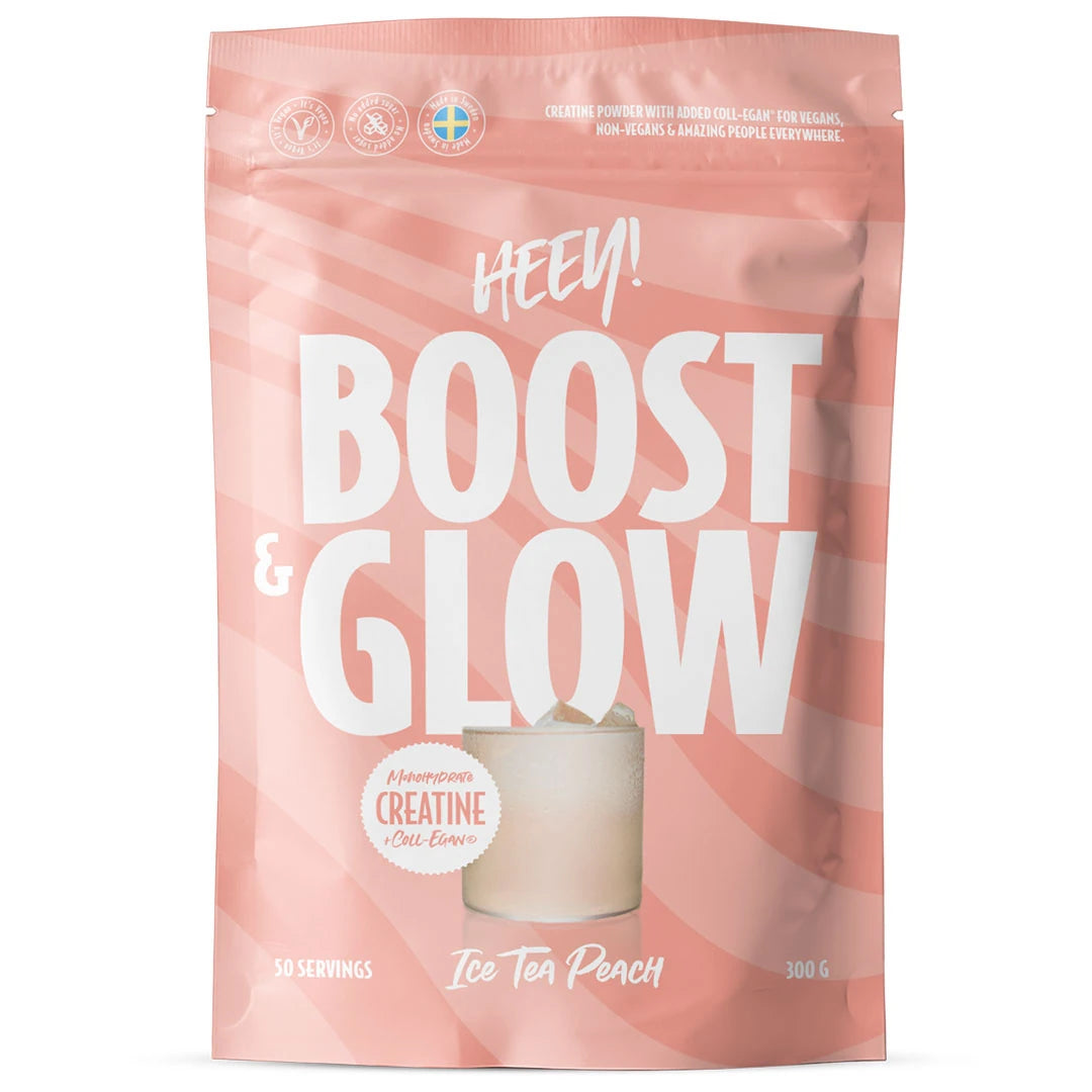 Heey! Boost & Glow Creatine + Coll-egan® 300 g vaaleanpunaisessa pussissa valkoisella tekstillä, makuna Ice Tea Peach.