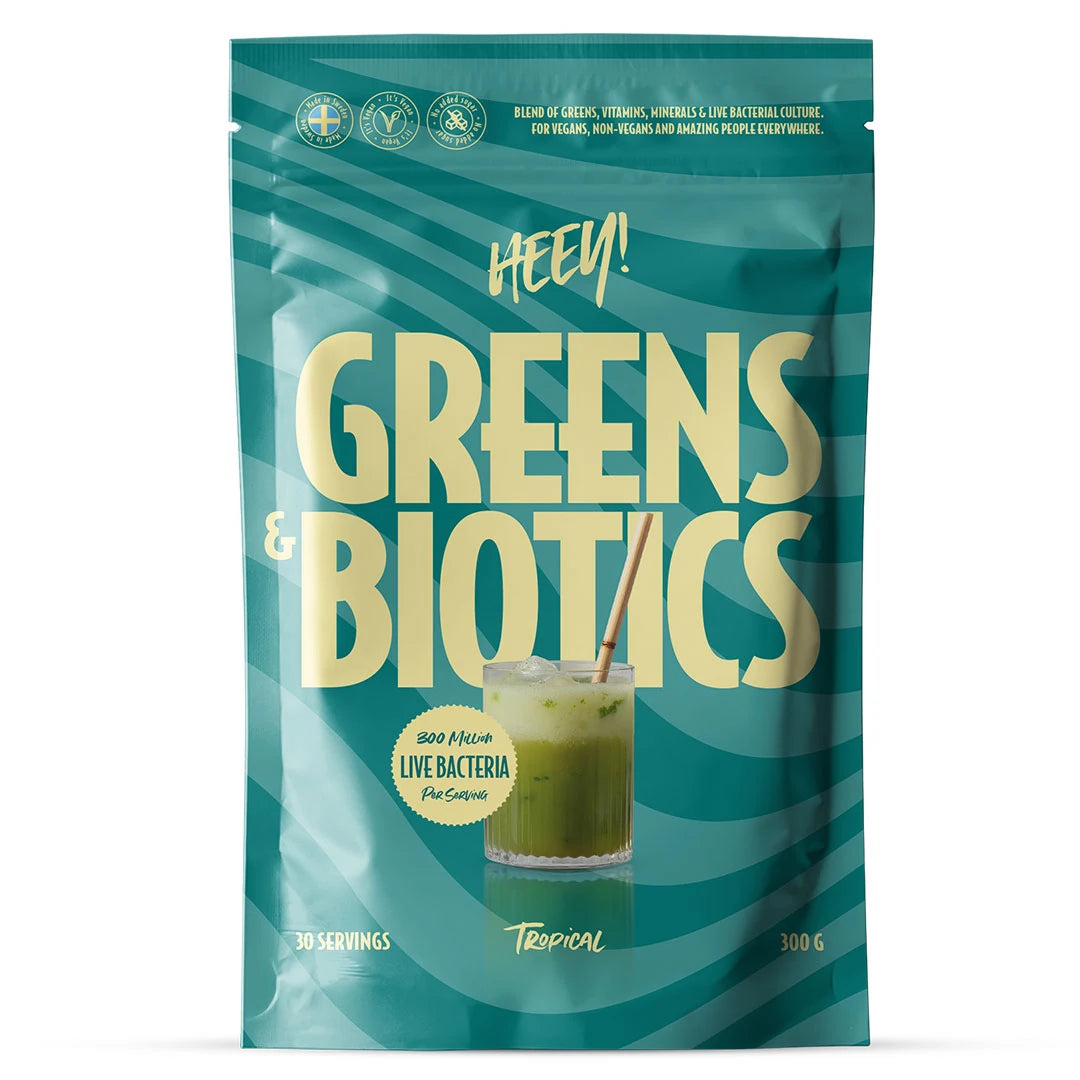 Heey! Greens & Biotics Superfood + Probiotics 300 g -jauhe sinivihreässä pussissa, makuna Tropical.