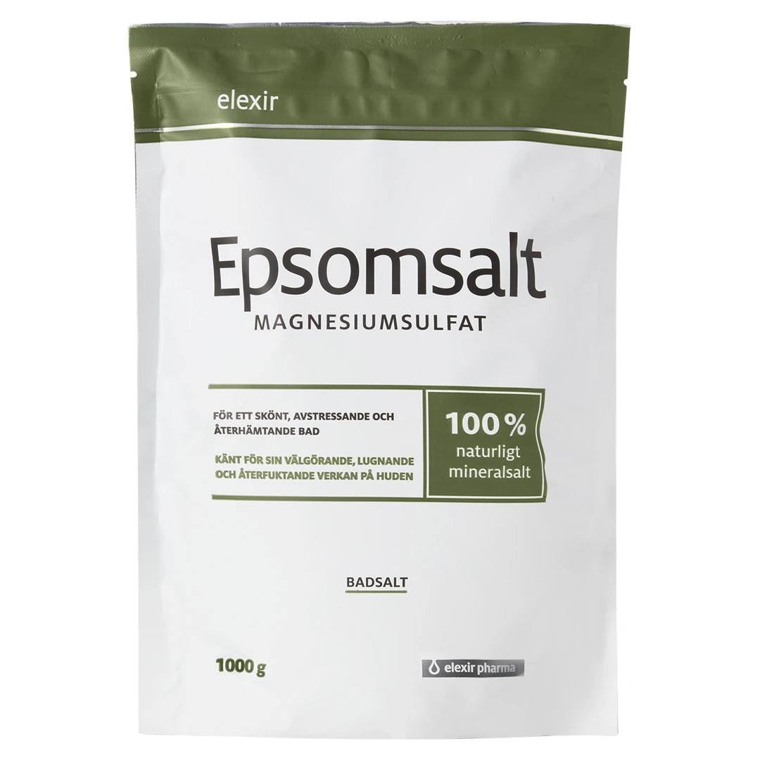 Elexir Pharma Epsomsalt 1kg valkoisessa pussissa oliivinvihreillä yksityiskohdilla rentouttaviin kylpyihin.