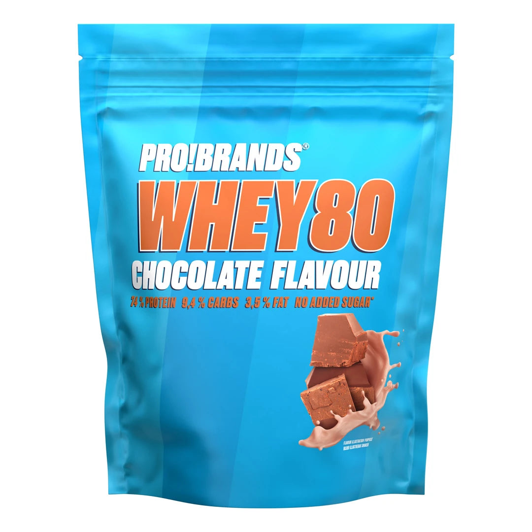 Pro Brands Whey Powder 500 g -proteiinijauhe vaaleansinisessä pussissa oranssilla tekstillä, makuna Chocolate.