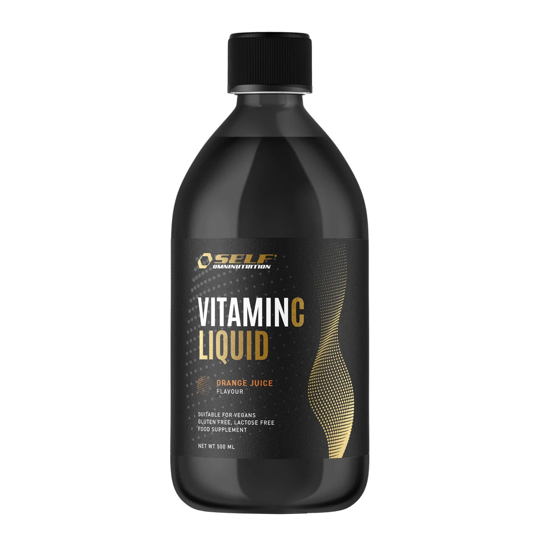 Musta pullo nestemäistä Self Omninutrition Vitamin C Liquid 500 ml -C-vitamiinia oranssein ja kultaisin yksityiskohdin.
