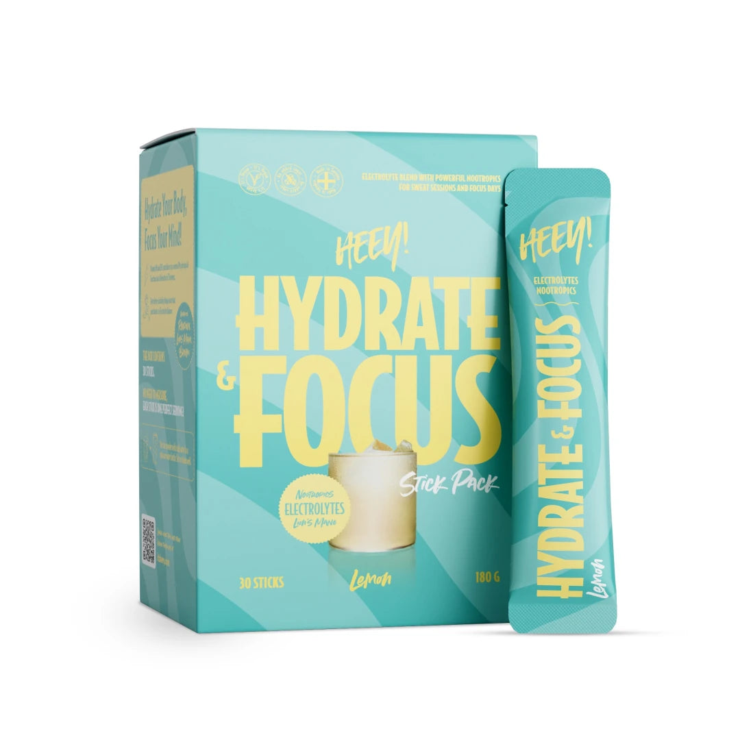 Heey! Hydrate & Focus Electrolytes + Lions Mane 30 x Stick Pack Lemon turkoosissa rasiassa ja annospussissa.