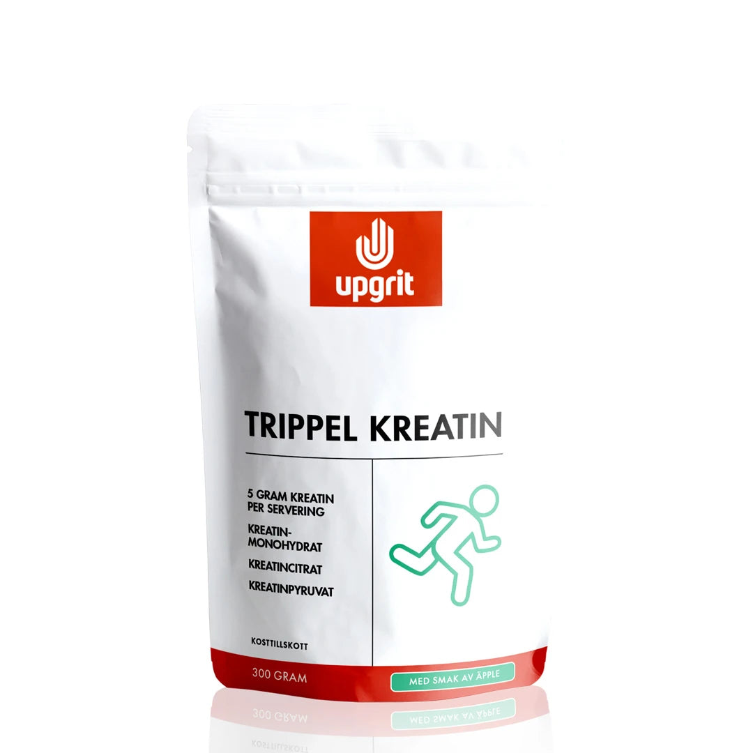 Upgrit Trippel Kreatin 300 g -jauhe valkoisessa pussissa, jossa on punaisia ja vihreitä yksityiskohtia sekä vihreä hahmo.