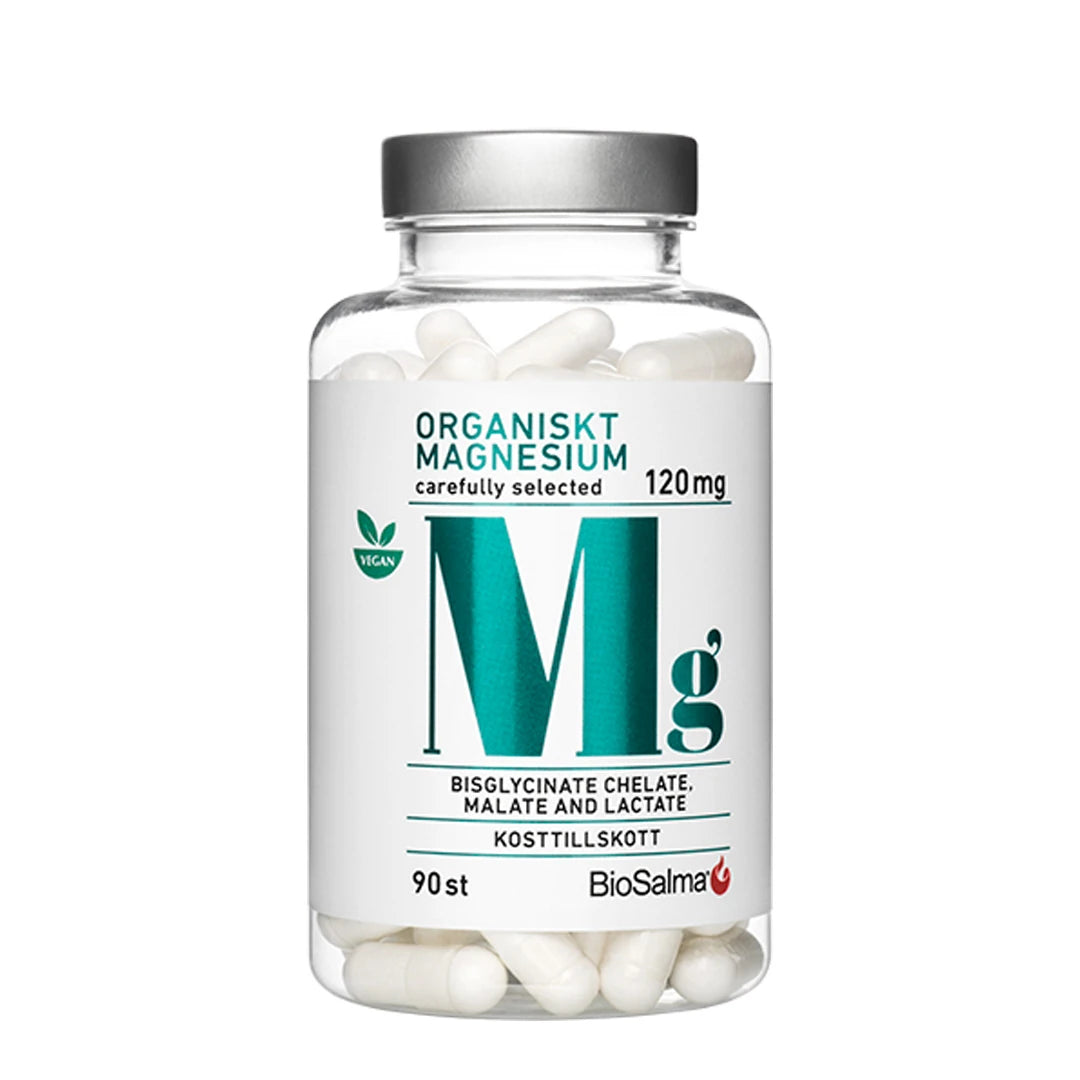 BioSalma Organiskt Magnesium 120 mg 90 tabs läpinäkyvässä purkissa, jossa on hopeinen kansi ja valkoisia kapseleita.