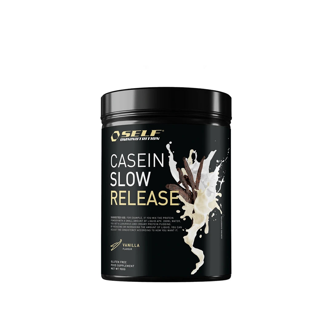 Self Omninutrition Casein 900 g -kaseiiniproteiinijauhe mustassa purkissa, jossa on kuvitus vaniljatangoista ja maitoroiskeista maulle Vanilla.