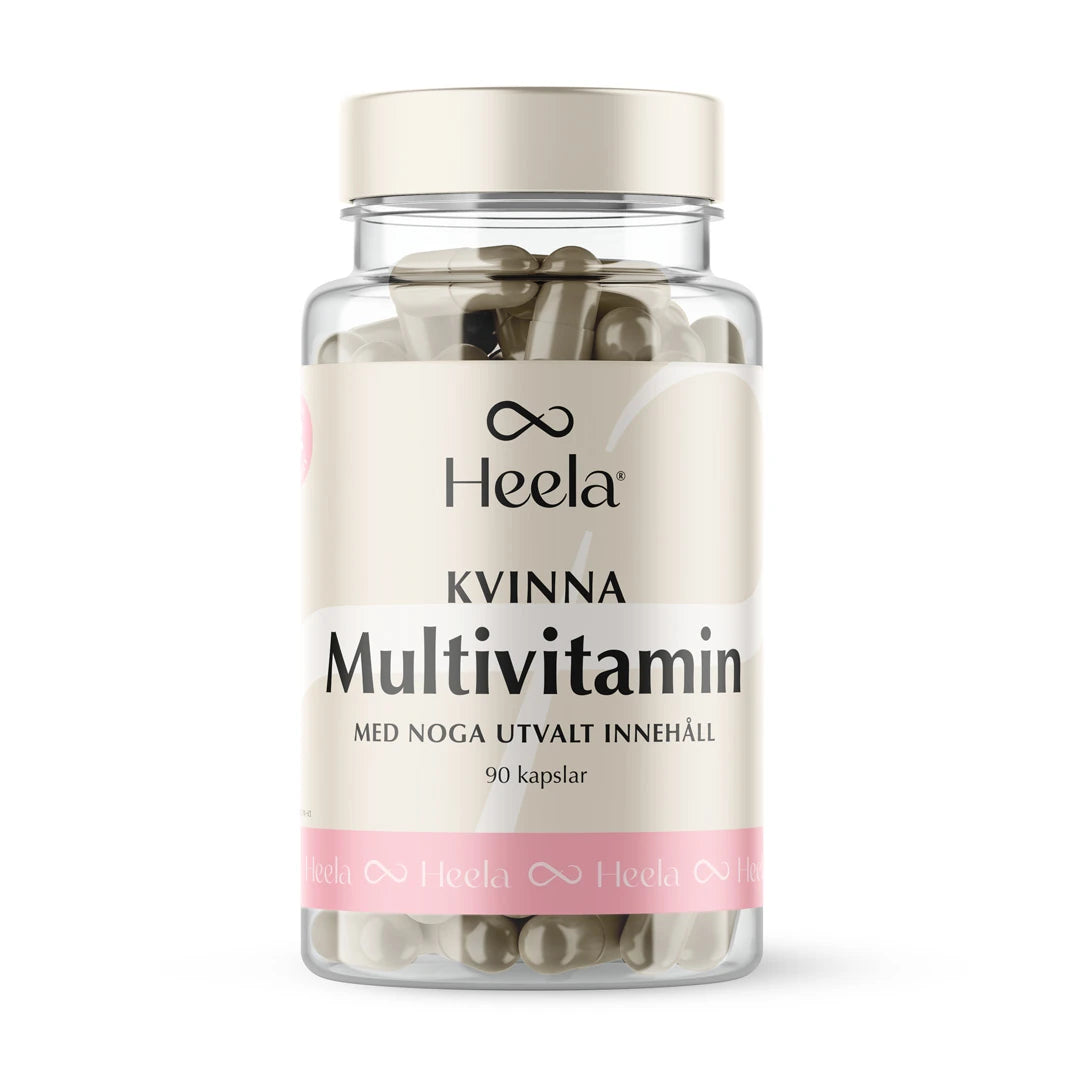 Heela Multivitamin Woman 60 caps läpinäkyvässä purkissa, jossa on vaalea kansi ja beige etiketti pinkeillä yksityiskohdilla.
