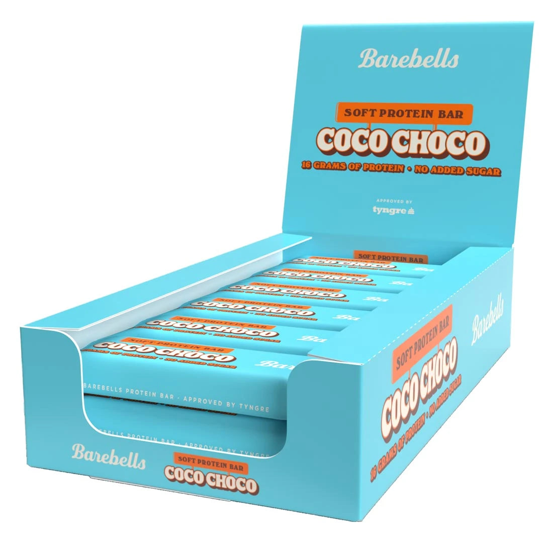 12 x Barebells Soft Protein Bar 55 g Coco Choco vaaleansinisessä esittelylaatikossa oransseilla yksityiskohdilla.