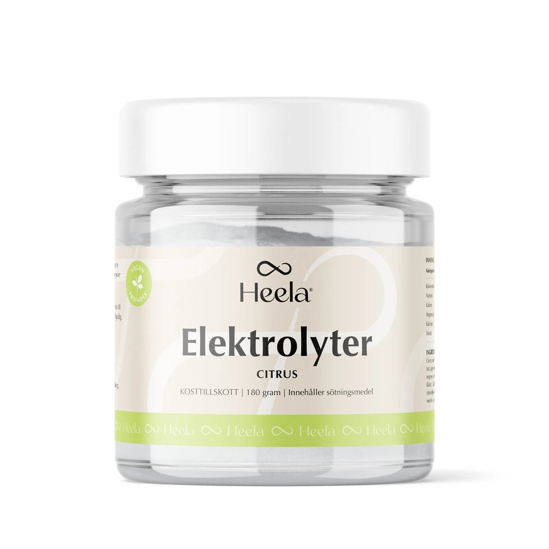 Heela Elektrolyter 180 g sitrus-elektrolyyttijauhe läpinäkyvässä purkissa valkoisella kannella ja vihreällä etiketillä.