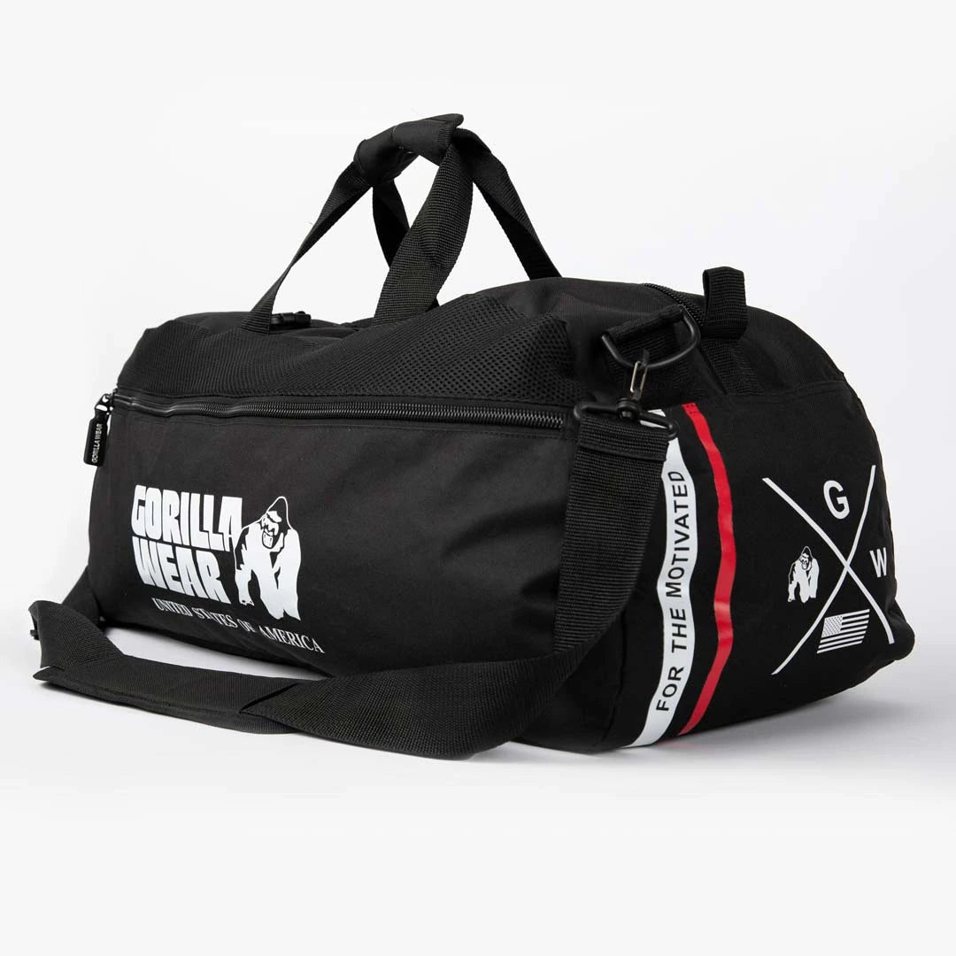 Musta polyesterinen Gorilla Wear Norris Hybrid Gym Bag/Backpack Black -treenikassi punavalkoisilla yksityiskohdilla.