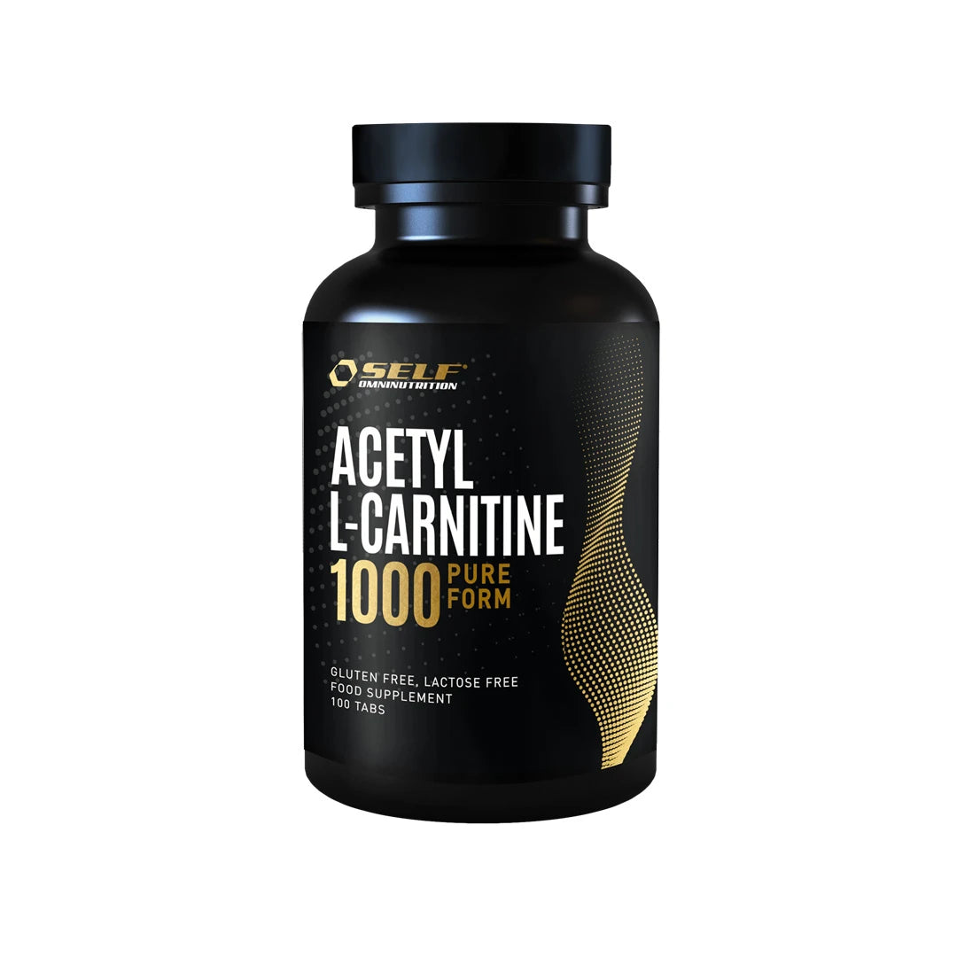 Self Omninutrition Acetyl L-Carnitine 1000 100 tabs -ravintolisä mustassa purkissa, jossa on kultaisia ja valkoisia yksityiskohtia.