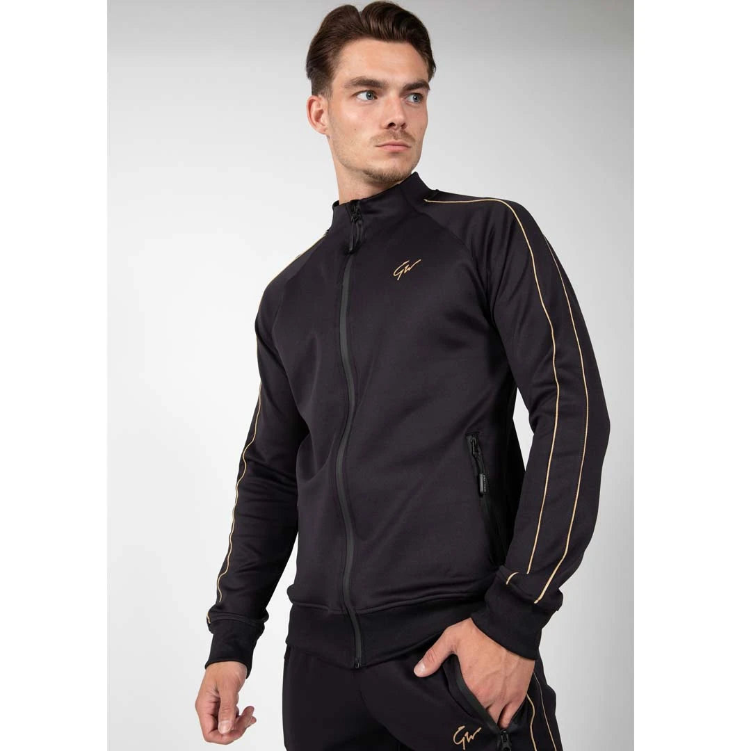 Gorilla Wear Wenden Track Jacket Black/Gold, musta treenitakki kultaisilla raidoilla miehen yllä., kuva 2/8