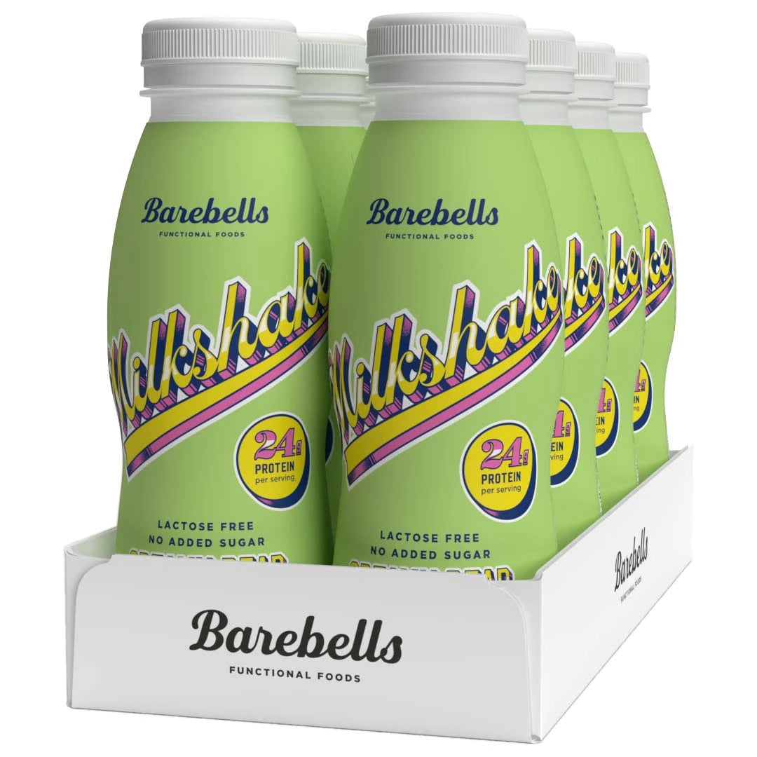8 x Barebells Milkshake 330 ml Creamy Pear valkoisessa laatikossa, jossa on vaaleanvihreitä pulloja retrotekstillä.