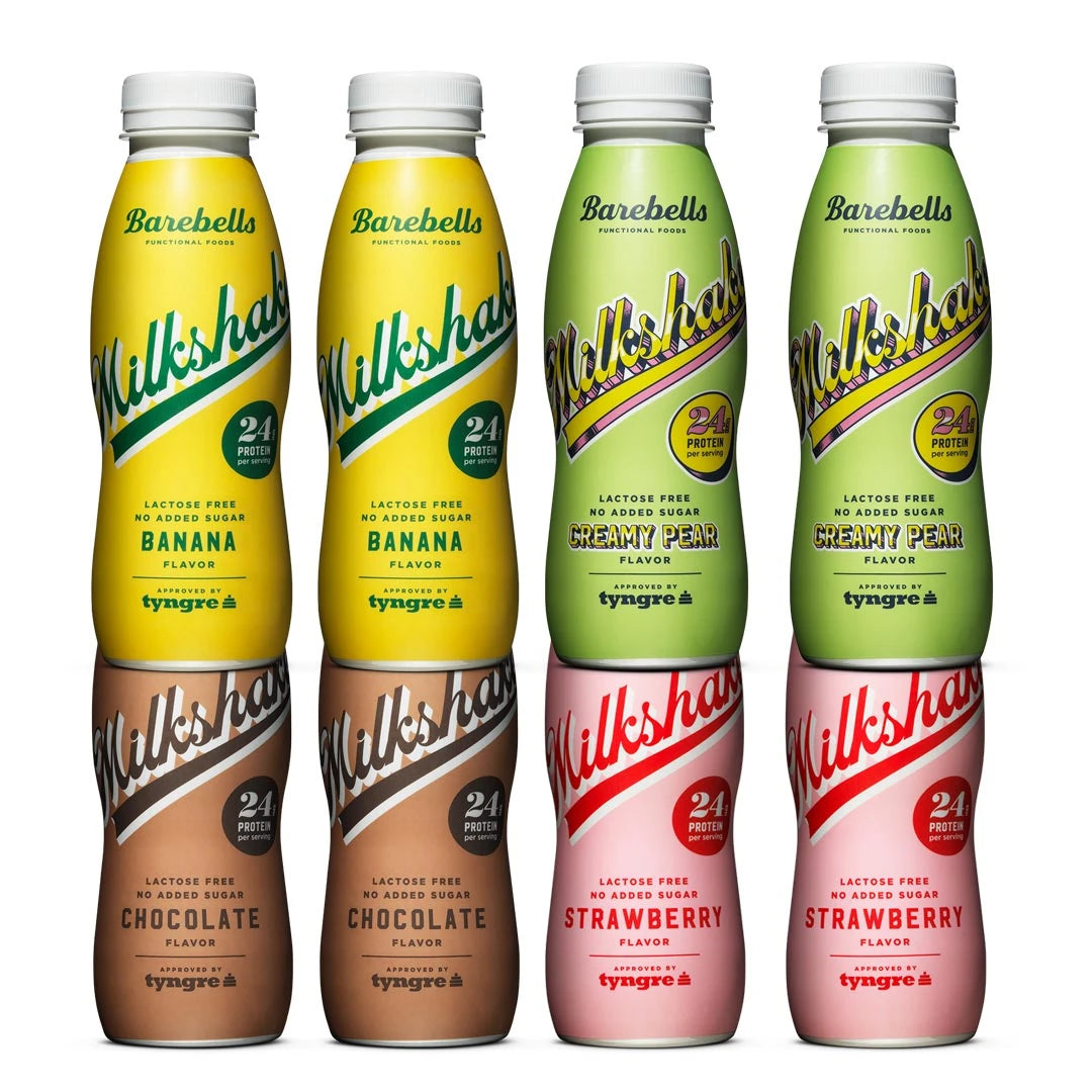 8 x Barebells Milkshake 330 ml -juomia kahdeksassa värikkäässä muovipullossa neljässä eri maussa.
