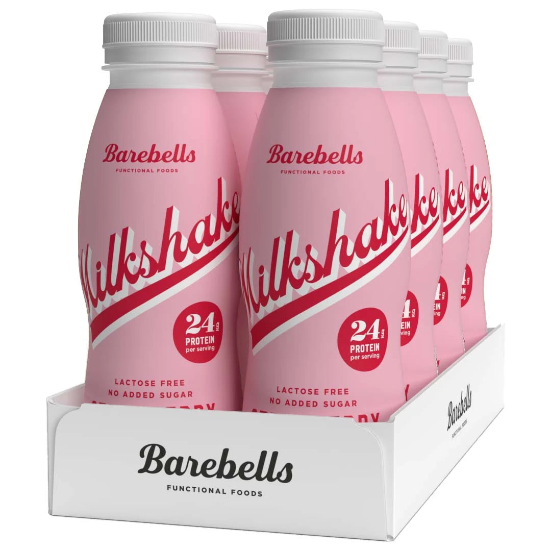 8 x Barebells Milkshake 330 ml Strawberry valkoisessa pakkauksessa, vaaleanpunaiset pullot punaisilla yksityiskohdilla.