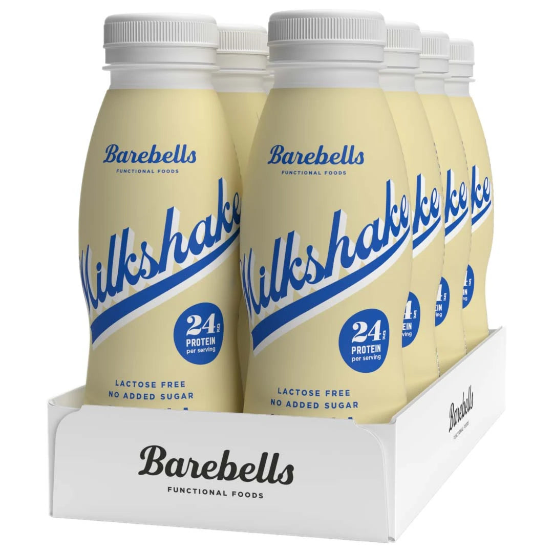 8 x Barebells Milkshake 330 ml Vanilla vaaleankeltaisissa pulloissa sinisellä tekstillä, valkoisessa laatikossa.