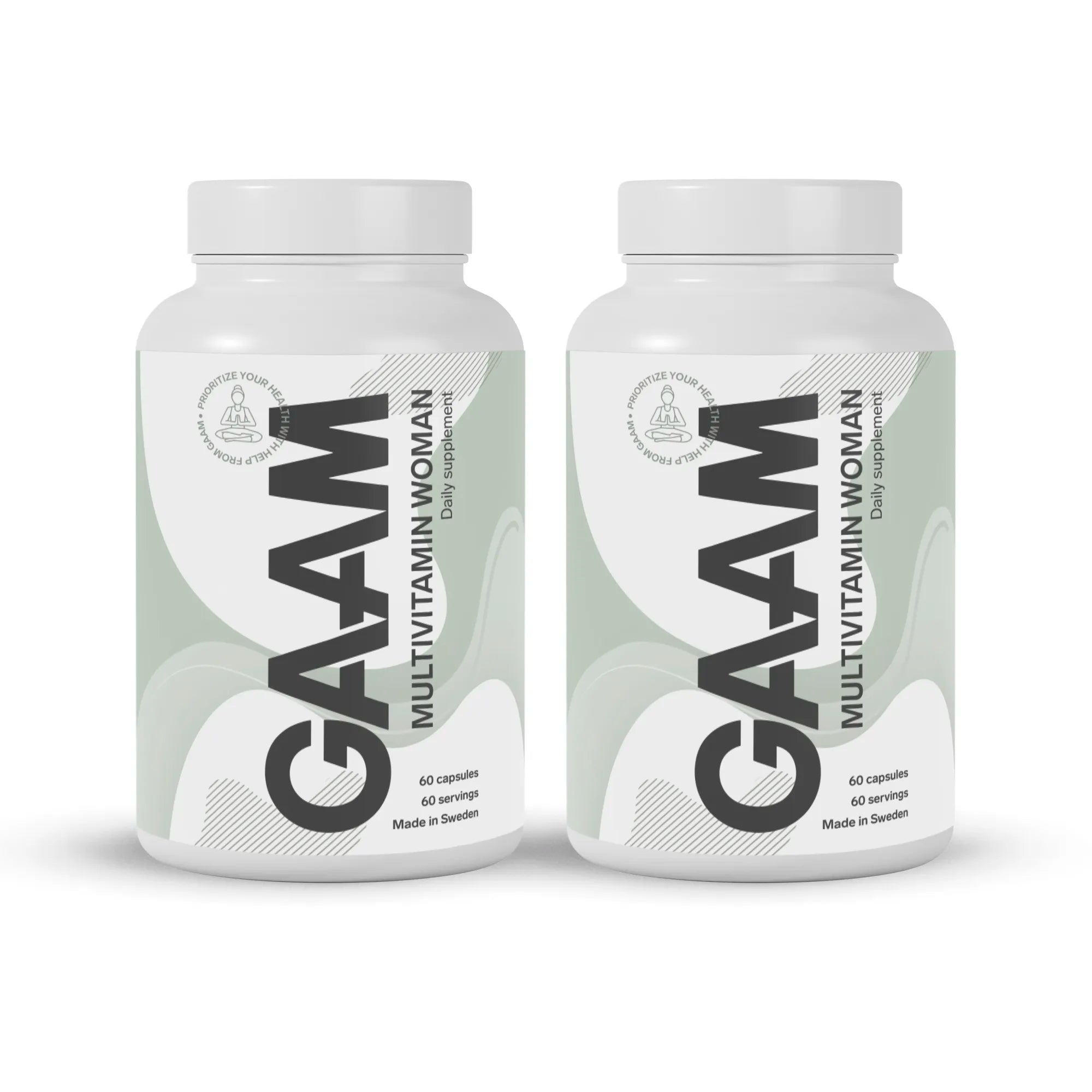 2 x GAAM Multivitamin Woman 60 caps kahdessa valkoisessa purkissa, joiden etiketissä on vaaleanvihreitä yksityiskohtia.