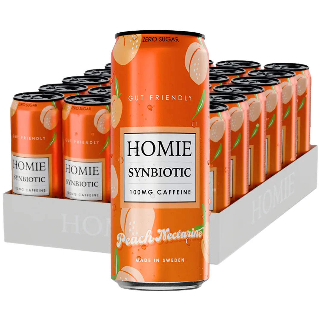 24 x Homie Wake Up Synbiotic 330 ml Peach Nectarine valkoisessa laatikossa oransseja tölkkejä persikkakuvioilla.
