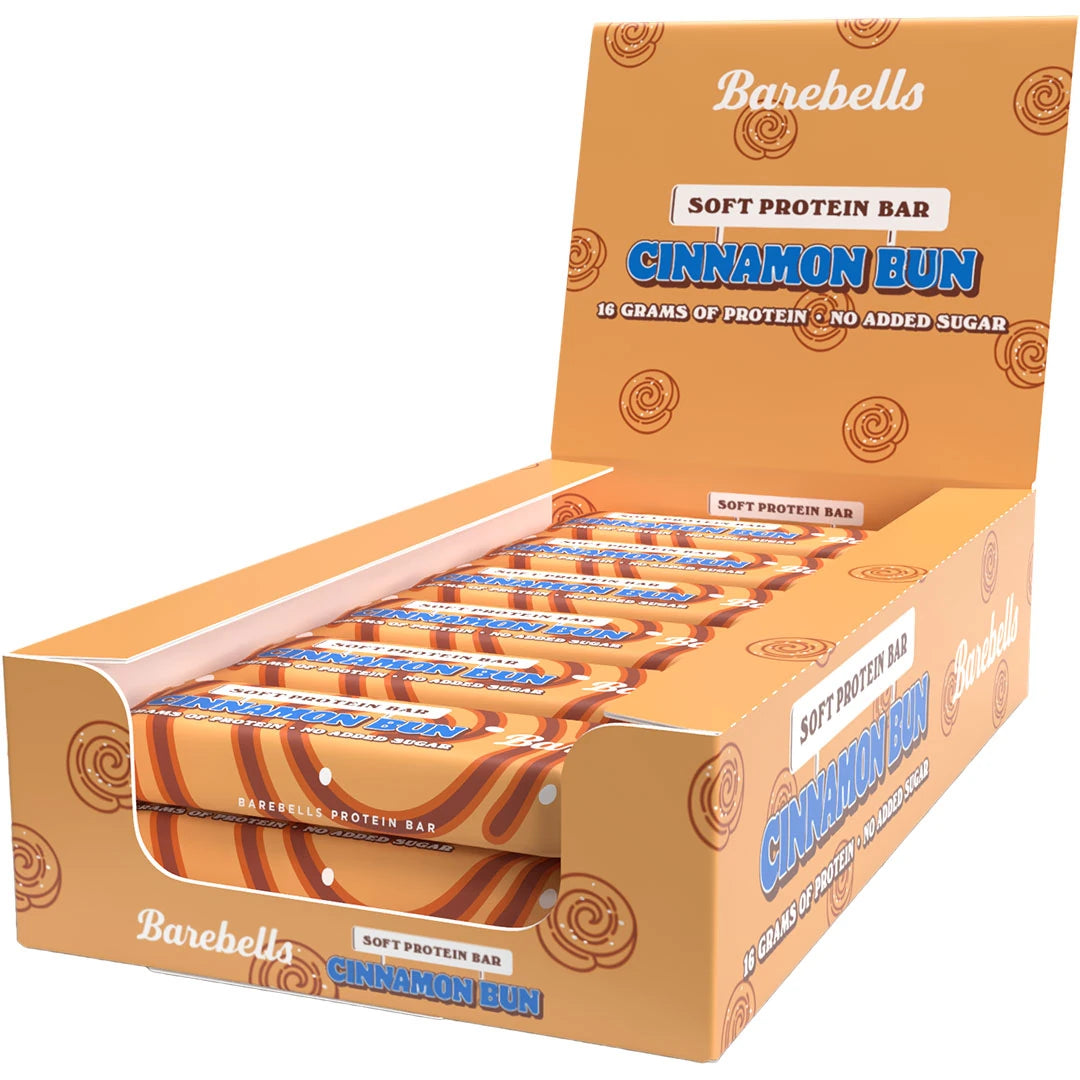 12 x Barebells Soft Bar 55 g Cinnamon Bun oranssissa laatikossa kanelipullakuvioilla ja sinisillä yksityiskohdilla.