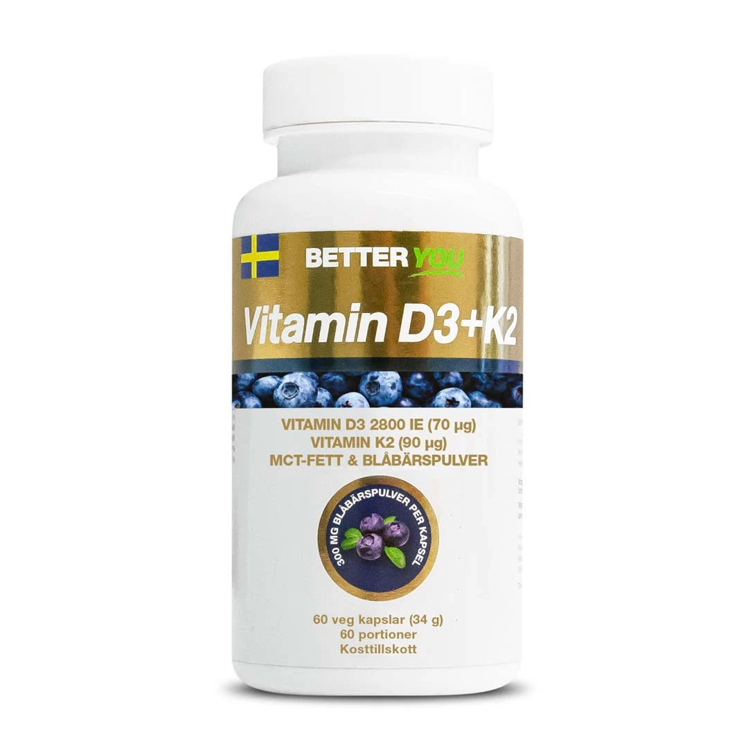 Better You Vitamin D3+K2 60 caps immuunijärjestelmälle, pakattuna valkoiseen purkkiin, jossa on mustikkakuvio ja kultaisia yksityiskohtia.