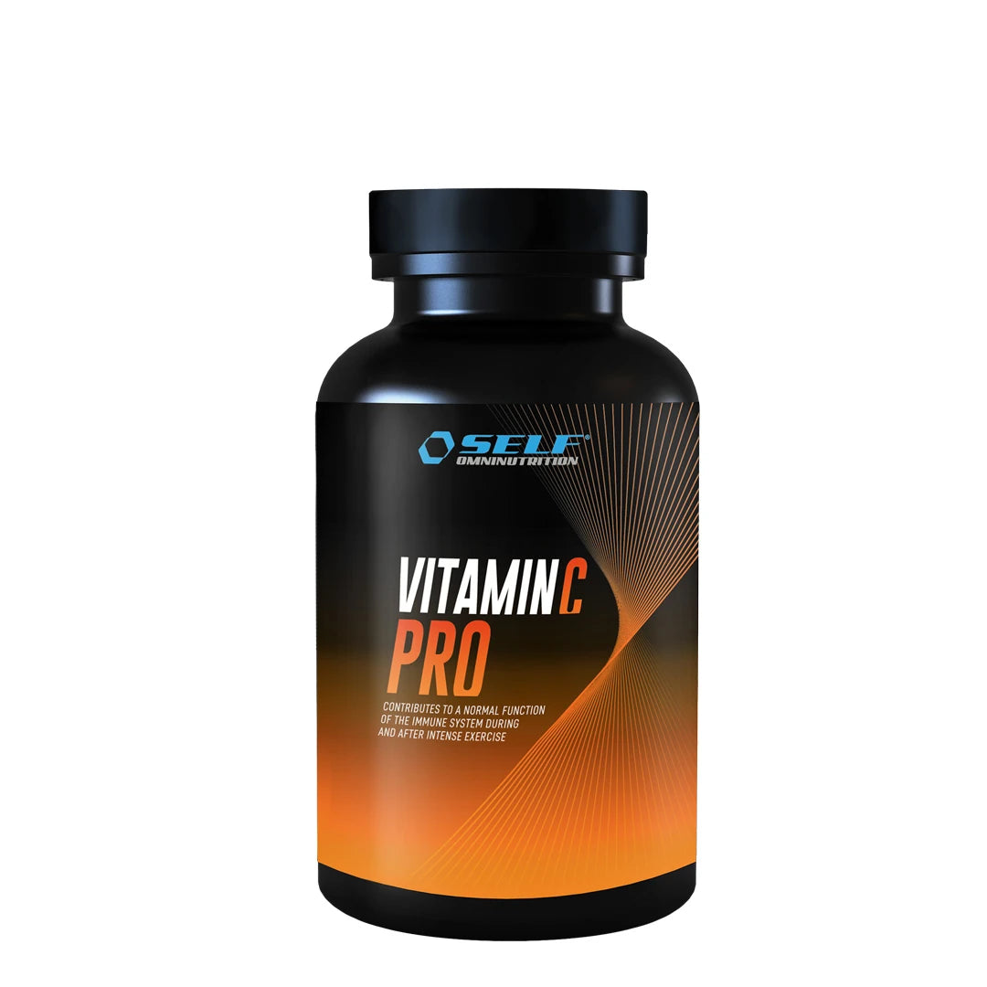Self Omninutrition Vitamin C PRO 100 Tabs -ravintolisä pakattuna mustaan purkkiin, jossa on oransseja yksityiskohtia.