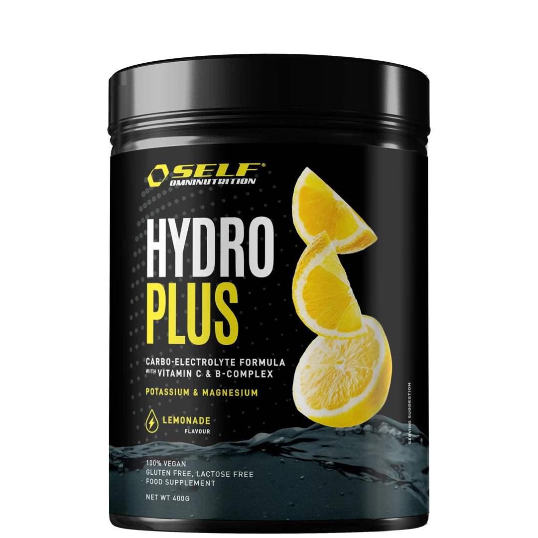 Self Omninutrition Hydro Plus 400 g mustassa purkissa Lemonade-maussa, kuvitettuna sitruunaviipaleilla ja roiskuvalla vedellä.