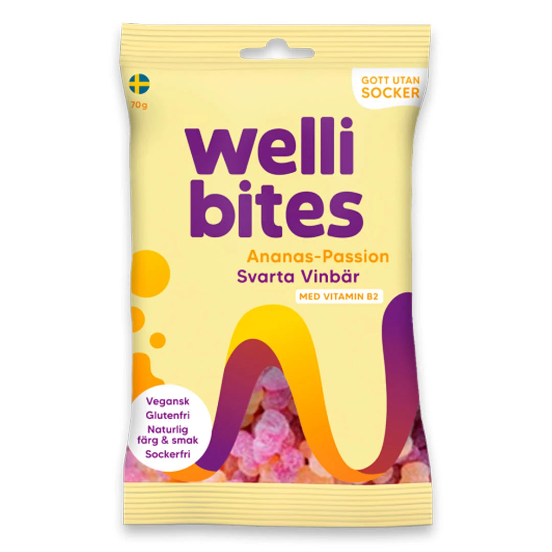Wellibites Candy 70 g vaaleankeltaisessa pussissa liloilla ja oransseilla sävyillä, makuna ananas-passion &amp; mustaherukka., kuva 3/6