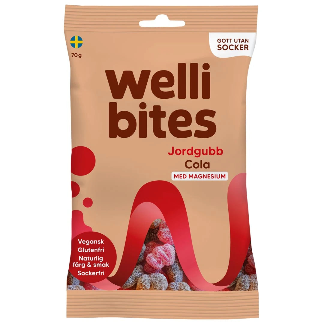 Wellibites Candy 70 g -sokeriton karkki beigessä pussissa punaisilla yksityiskohdilla, makuna Mansikka Cola.