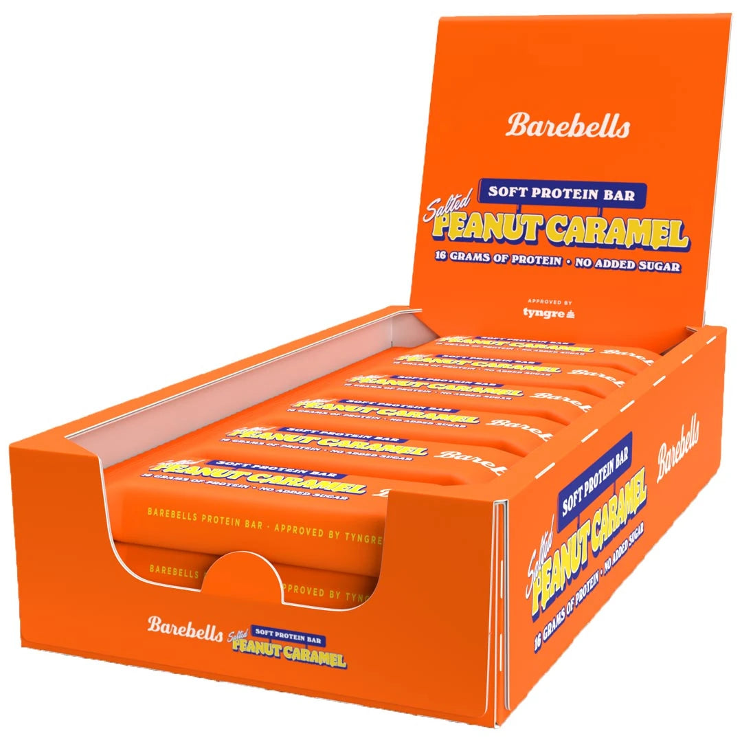 12 x Barebells Soft Protein Bar 55 g Salted Peanut Caramel oranssissa esittelylaatikossa.