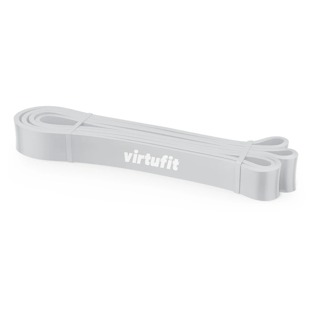 Vaaleanharmaa Virtufit Power Band Extra Light -vastuskuminauha valkoisella logolla lämmittelyyn ja voimaharjoitteluun.