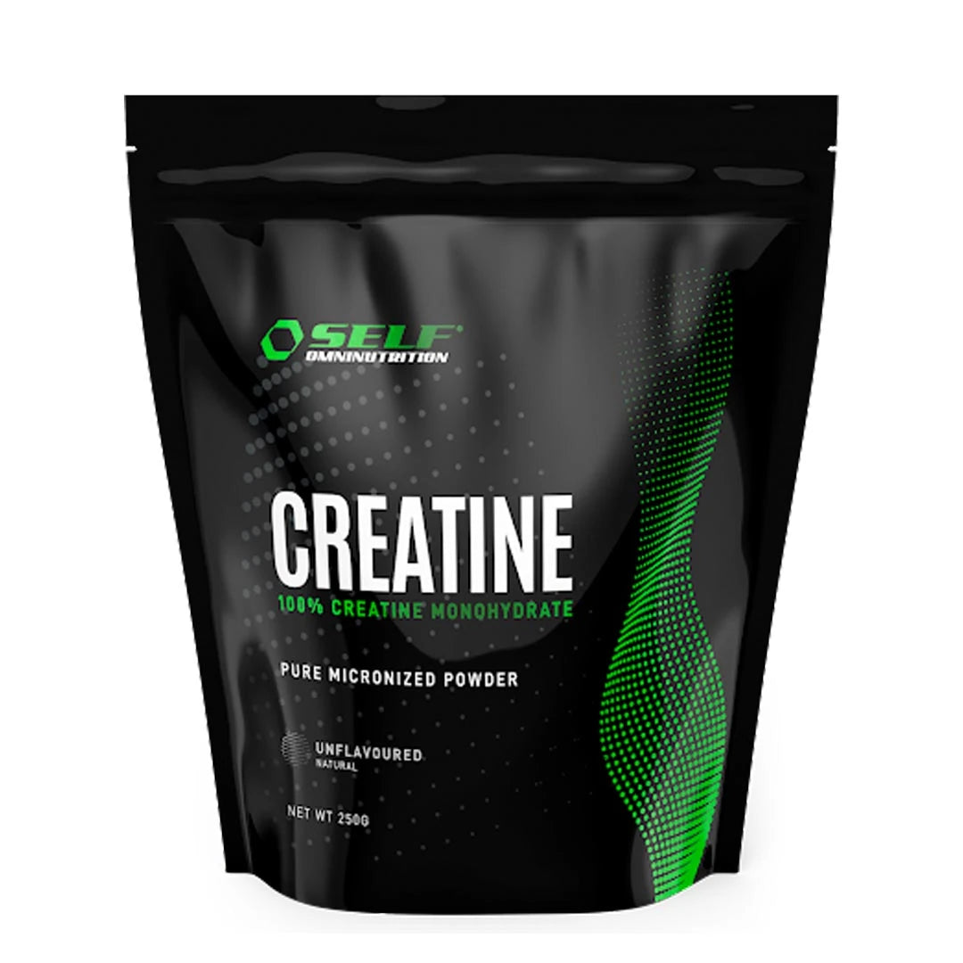 Self Omninutrition Creatine 250 g -maustamaton kreatiinijauhe mustassa pussissa vihreillä yksityiskohdilla.