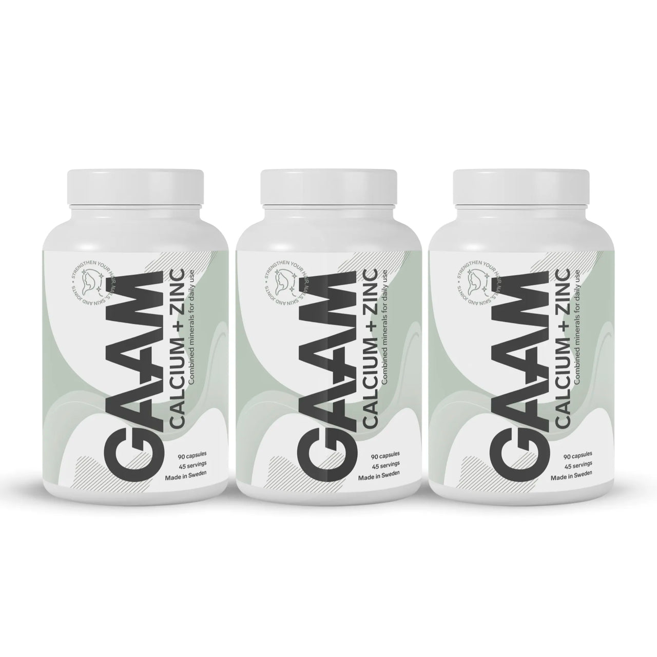 3 x GAAM Calcium + Zinc 90 caps valkoisissa purkeissa, joissa on vihreävalkoiset etiketit ja mustia yksityiskohtia.