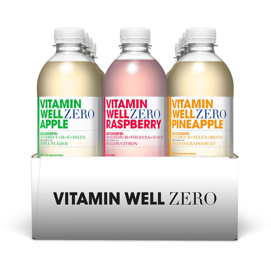 12 x Vitamin Well Zero 500 ml valkoisessa laatikossa, muovipullojen makuina Apple, Raspberry ja Pineapple.