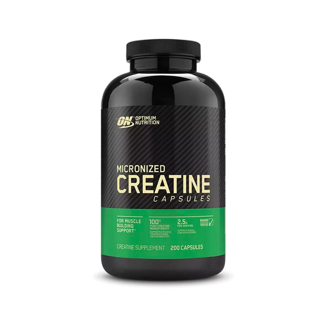 Optimum Nutrition Creatine Capsules 200 caps mustassa purkissa, jossa on vihreä etiketti.